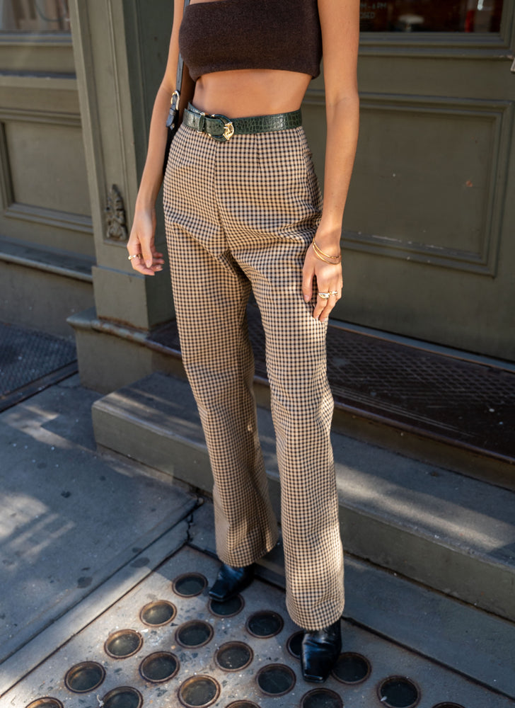 Ruby modelling our classic trousers in a wide-leg full-length silhouette. High-waisted and styled with a belt and cashmere bra.