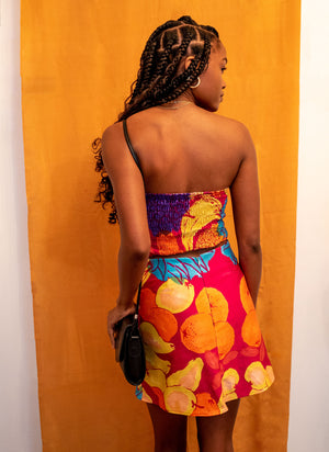 
                  
                    load image into gallery viewer, A dress for Maddy on Euphoria: strapless tube top upper with perfect mini skirt, sustainable and upcycled using vintage fabric. Fruit print.
                  
                