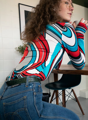 
                  
                    load image into gallery viewer, the ASPEN TOP - a semi-sheer second-skin long-sleeve top in vintage disco prints, with thumb holes and a boat neckline
                  
                