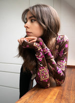 the ASPEN TOP - a semi-sheer second-skin long-sleeve top in vintage disco prints, with thumb holes and a boat neckline