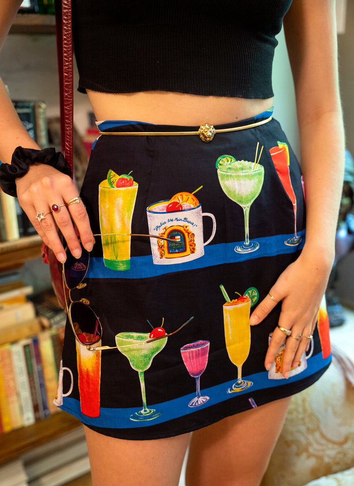 
                  
                    load image into gallery viewer, Our CULT-FAV mini skirt: A-line, high-waisted, and covered in cute prints! Made of vintage fabric, printed with cocktails. As seen in NY Mag, WWW, V Mag, etc.
                  
                