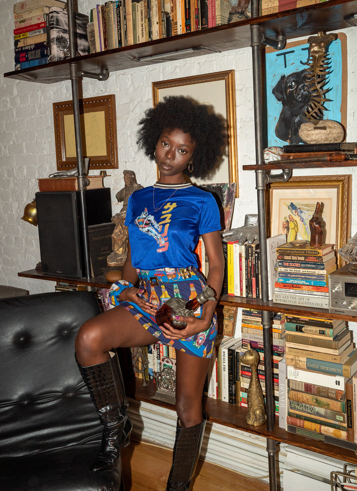 
                  
                    load image into gallery viewer, Our CULT-FAV high-waisted A-line mini skirt, featured in Man Repeller, V Mag, Who What Wear, and more. Totally sustainable. Upcycled using psychedelic and kitschy printed vintage fabrics.
                  
                