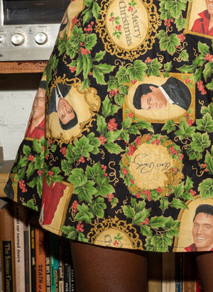 
                  
                    load image into gallery viewer, 1970s christmas outfit: A-line mini skirt covered in Elvis Presley Christmas print 
                  
                
