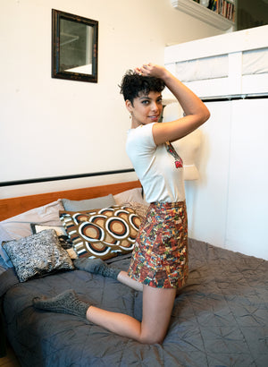 
                  
                    load image into gallery viewer, 1970s mini skirt, modelled on bed with a t-shirt and socks. 
                  
                