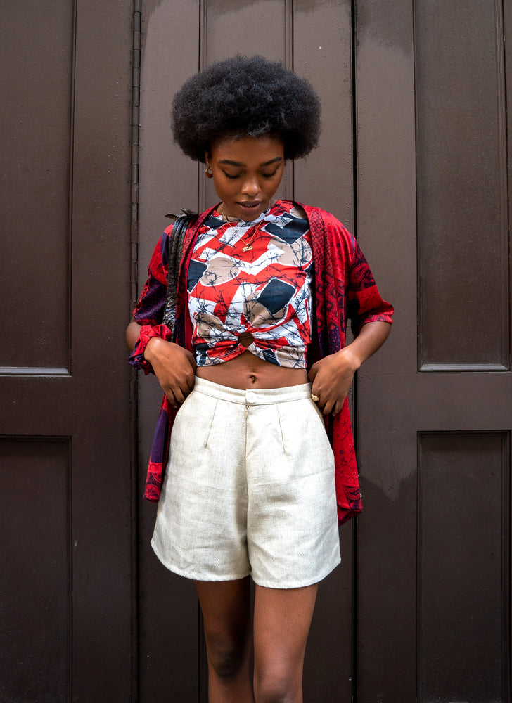 
                  
                    load image into gallery viewer, Perfect sustainable spring outfit. Upcycled gold raw silk shorts - high-waisted, wide-leg, and short-length. Styled on Black model with red tee and matching scrunchie.
                  
                