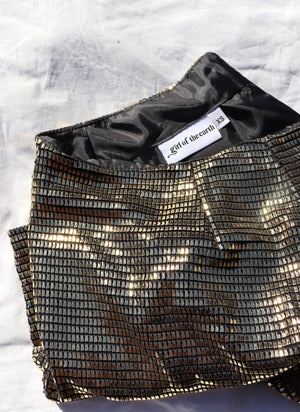 
                  
                    load image into gallery viewer, High-waisted A-line mini skirt sustainably made using upcycled vintage fabric. Gold mesh, very Reformation, Realisation, or just straight 1970s!
                  
                