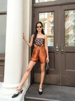 Perfect summer shorts outfit - high-waisted, wide-leg, and short-length. Styled with a scarf top.