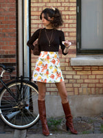 Citrus mini skirt. A-line, high-waisted, and totally sustainable. Shot in Copenhagen.
