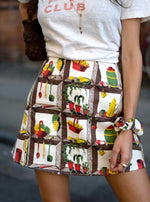 Cute summer outfit: Our cult-fav mini skirt: A-line, high-rise, and made of vintage fabric. Kitche print, very 1950s!!